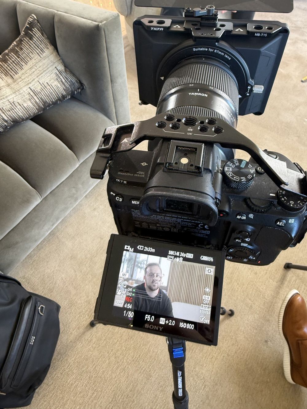 Camera on a tripod recording Cole DeFranco for a content shoot