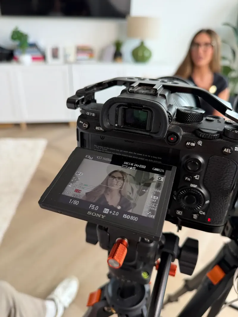 Camera on a tripod filming during a content shoot